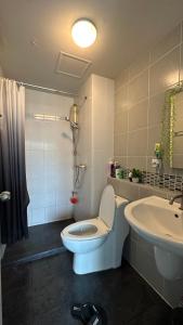 a bathroom with a toilet and a sink at D Condo phuket kathu- patong in Amphoe Kathu