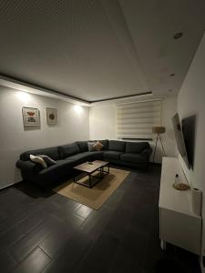 a living room with a couch and a table at Home in Attnang-Puchheim