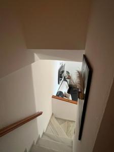 a hallway with a staircase with a sink in a room at Casa Sylvia in Algeciras