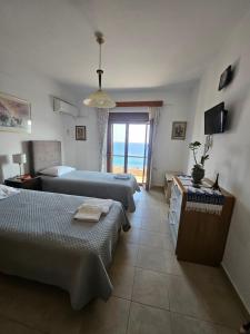 A bed or beds in a room at VILLA PETRINO