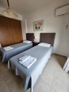 A bed or beds in a room at VILLA PETRINO