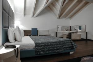 Llit o llits en una habitació de Blu9 Hotel