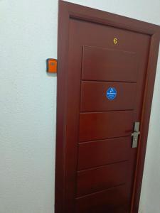 a brown door with a blue sticker on it at Cozy apartment with sea view in Petrovac na Moru