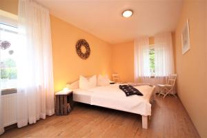 Ένα ή περισσότερα κρεβάτια σε δωμάτιο στο Wohnung 2