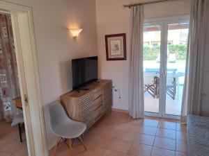 A television and/or entertainment centre at Villa Filia std