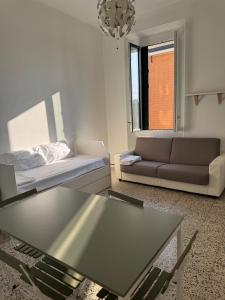 a living room with a couch and a coffee table at Appartamento Duomo-Sempione in Milan +4 photos