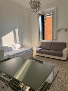 a living room with a couch and a coffee table at Appartamento Duomo-Sempione in Milan
