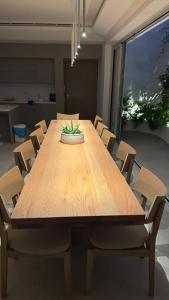 a wooden table in a room with chairs at Pasithea Horizon in Kampos Paros