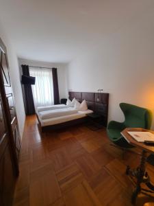 Voodi või voodid majutusasutuse B&B Zur Post toas