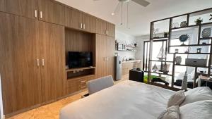 a bedroom with a bed and a tv in a room at Piedra Azul in Playa del Carmen