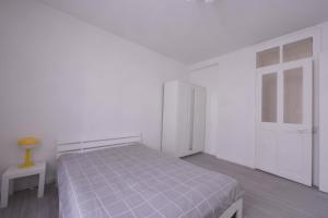 Katil atau katil-katil dalam bilik di Appartement T3,5 Fairey