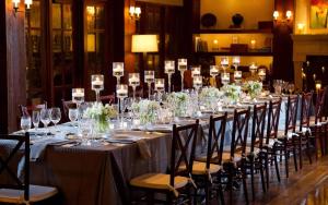 a long table with wine glasses and flowers on it at 3 Bedroom Wilson Village Home 19 in Bluffton +59 photos