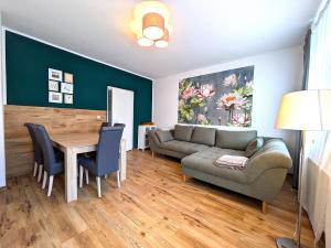 a living room with a couch and a table at Seerose in Görlitz
