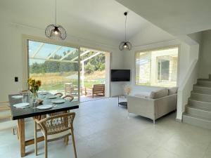 a living room with a table and a couch at Villa Maria in Elani