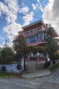 a large house with a gate in front of it at Trabzon Gürbulakta kiralık villa in Trabzon