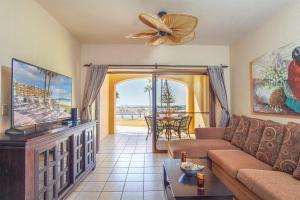 a living room with a couch and a flat screen tv at Princesa De Penasco in Punta Penasco New