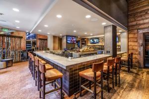 a bar in a restaurant with brown chairs at Luxe Bachelor Gulch Getaway! in Edwards