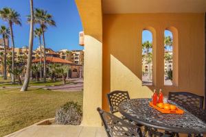 a table with a tray of oranges on a patio at Princesa De Penasco in Punta Penasco New