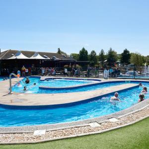 a group of people in a swimming pool at Hummingbird Retreat in Blackpool