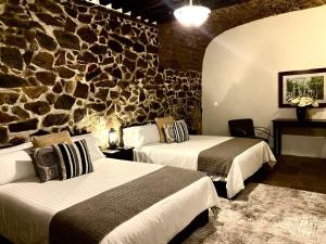 Postel nebo postele na pokoji v ubytování HOTEL MINA REAL