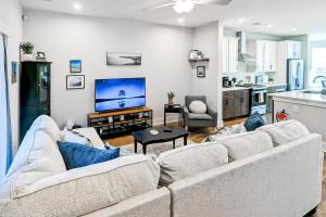 a living room with a couch and a kitchen at 4563 Summey in Charleston
