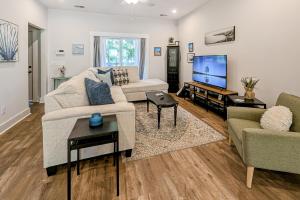a living room with a couch and a tv at 4563 Summey in Charleston