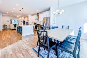 a kitchen and dining room with a table and chairs at 4563 Summey in Charleston