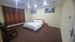 Vuode tai vuoteita majoituspaikassa Hotel Bloom Hills Skardu