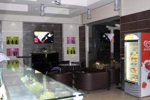 A television and/or entertainment centre at Otto&Mezzo B&B