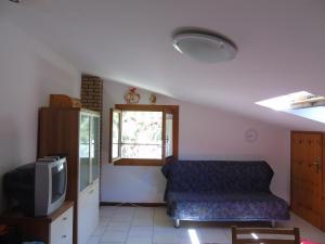 A television and/or entertainment centre at Bibione villa Torino via della bilancia 43