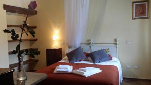 Postel nebo postele na pokoji v ubytování Agriturismo Saudon