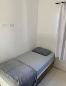 Postel nebo postele na pokoji v ubytování Casa no Litoral em Matinhos