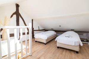 Ένα ή περισσότερα κρεβάτια σε δωμάτιο στο Appartement atypique - coeur historique de Liège