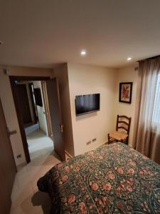 Ένα ή περισσότερα κρεβάτια σε δωμάτιο στο Viladrau Paz y Naturaleza +3 φωτογραφίες