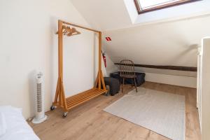 Ένα ή περισσότερα κρεβάτια σε δωμάτιο στο Appartement atypique - coeur historique de Liège