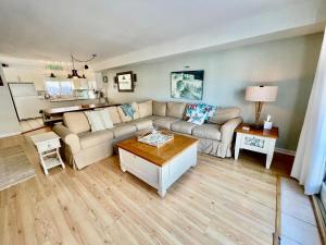 a living room with a couch and a coffee table at Ocean sands 4 in Rehoboth Beach
