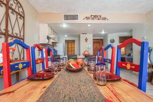 a dining room with a table with a bowl of fruit at Princesa De Penasco in Punta Penasco New