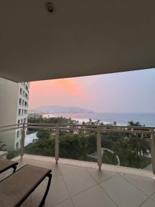 a balcony with a view of the ocean at Oceanfront Condo in Ixtapa, Zihuatanejo in Ixtapa