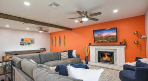 a living room with a couch and a fireplace at Laurel Gilbert in Gilbert