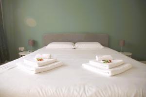 Postel nebo postele na pokoji v ubytování Beautiful Cosy 2BR Apartment