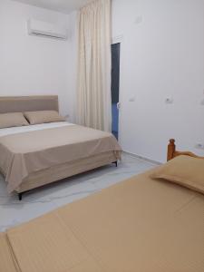 Postel nebo postele na pokoji v ubytování Vila REJANA