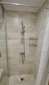 a shower with a glass door in a bathroom at Copacabacum Sea View in Varna City +20 photos