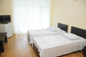 Letto o letti in una camera di Black Sea Hotel