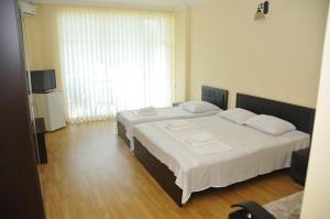 Letto o letti in una camera di Black Sea Hotel
