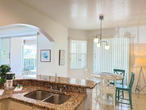a kitchen with a sink and a counter top at 5 bedrooms pool home Calabay in Davenport
