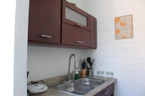 Kuchyň nebo kuchyňský kout v ubytování San Juan Apartment