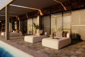 a living room with two couches and a pool at Mapito Safari Camp, Serengeti, Autograph Collection in Serengeti +34 photos