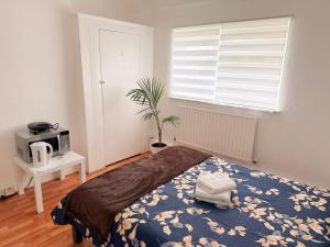 Ένα ή περισσότερα κρεβάτια σε δωμάτιο στο Lovely Room in Wembley Stadium +23 φωτογραφίες
