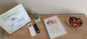 a table with two books and a bowl of food at La Casetta in Ameno +40 photos