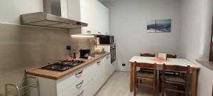 a kitchen with a stove and a counter top at La Casetta in Ameno